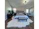 Large primary bedroom with wood floors, area rug, upholstered bed, and natural light at 28 Samuel Nw Way, Cartersville, GA 30121