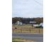 Scenic view of a classic farmhouse with outbuildings, showcasing rural charm at 28 Samuel Nw Way, Cartersville, GA 30121