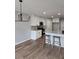 Modern kitchen featuring white cabinets, stainless steel appliances, granite countertops, island and hardwood floors at 28 Samuel Nw Way, Cartersville, GA 30121
