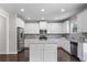 Well-equipped kitchen featuring granite counters, stainless appliances, and a central island at 4830 Frontier Dr, Cumming, GA 30028