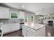 Bright kitchen featuring granite counters, stainless appliances, an island and an open floor plan at 4830 Frontier Dr, Cumming, GA 30028