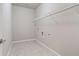 Laundry room with light tile floors, wire shelving, and hook ups, perfect for getting laundry done at 4830 Frontier Dr, Cumming, GA 30028