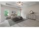 Spacious main bedroom features a tray ceiling, two windows, and neutral-toned decor at 4830 Frontier Dr, Cumming, GA 30028