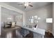 Office space with view into dining room, hardwood floors, and gray walls at 4830 Frontier Dr, Cumming, GA 30028