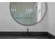 Close-up of bathroom vanity with granite countertop, undermount sink, and sleek black faucet at 90 Cleveland Unit A Se St, Atlanta, GA 30316