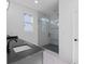 Sleek bathroom featuring a glass-enclosed shower and modern vanity with a black countertop for a luxurious feel at 90 Cleveland Unit A Se St, Atlanta, GA 30316