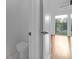 Half-bathroom featuring modern toilet, and a view of the hardwood floors into the next room at 90 Cleveland Unit A Se St, Atlanta, GA 30316