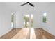 Bright bedroom with a ceiling fan, large windows, and gleaming wood floors, creating a cozy and inviting atmosphere at 90 Cleveland Unit A Se St, Atlanta, GA 30316