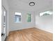 Minimalist bedroom showcasing hardwood floors, abundant natural light, and neutral decor at 90 Cleveland Unit A Se St, Atlanta, GA 30316