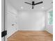 Modern bedroom featuring hardwood floors, ceiling fan, natural light and double door closet at 90 Cleveland Unit A Se St, Atlanta, GA 30316
