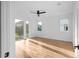 A spacious, sunlit bedroom featuring a modern ceiling fan and large windows showcasing lush outdoor greenery at 90 Cleveland Unit A Se St, Atlanta, GA 30316