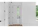 Bright entryway with white walls, wood floors, and a modern front door at 90 Cleveland Unit A Se St, Atlanta, GA 30316