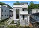Modern three-story home featuring a white and gray exterior with manicured landscaping at 90 Cleveland Unit A Se St, Atlanta, GA 30316