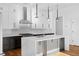 Modern kitchen featuring white cabinets, stainless steel appliances, and hardwood flooring at 90 Cleveland Unit A Se St, Atlanta, GA 30316