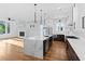 Open kitchen with large island, stainless steel appliances, and hardwood flooring throughout at 90 Cleveland Unit A Se St, Atlanta, GA 30316