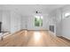 Sun-filled living room featuring hardwood floors and a modern fireplace at 90 Cleveland Unit A Se St, Atlanta, GA 30316