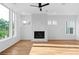 Sun-filled living room featuring hardwood floors and a modern fireplace at 90 Cleveland Unit A Se St, Atlanta, GA 30316