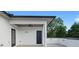 Covered patio with ceiling fan, outdoor lighting, and view of mature trees at 90 Cleveland Unit A Se St, Atlanta, GA 30316