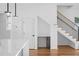 Staircase with wooden steps, black railings, and white walls, complemented by hardwood floors at 90 Cleveland Unit A Se St, Atlanta, GA 30316