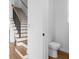Beautiful staircase with light wood treads and a black metal railing, blending modern design with classic elegance at 90 Cleveland Unit A Se St, Atlanta, GA 30316