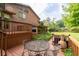Spacious backyard featuring a deck with an outdoor dining set at 140 N Star Sw Trl, Atlanta, GA 30331