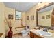 This charming bathroom features classic tile work, a pedestal sink, and is freshly renovated at 140 N Star Sw Trl, Atlanta, GA 30331