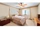 Comfortable bedroom with a ceiling fan, neutral decor, and natural light at 140 N Star Sw Trl, Atlanta, GA 30331