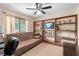 Bedroom featuring a futon and a large built-in bookshelf with a television at 140 N Star Sw Trl, Atlanta, GA 30331