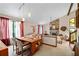 Bright dining room with wooden table and chairs, vaulted ceiling and stone fireplace at 140 N Star Sw Trl, Atlanta, GA 30331