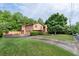 Traditional home featuring a two-car garage, well-kept lawn and established landscaping at 140 N Star Sw Trl, Atlanta, GA 30331