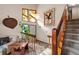 Bright foyer with hardwood stairs, unique windows, and decorative accents at 140 N Star Sw Trl, Atlanta, GA 30331