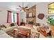 Comfortable living room featuring a stone fireplace, vaulted ceiling, and large windows at 140 N Star Sw Trl, Atlanta, GA 30331