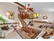 Spacious living room with exposed beams, vaulted ceiling, and hardwood staircase at 140 N Star Sw Trl, Atlanta, GA 30331
