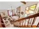Bright living room featuring a stone fireplace, vaulted ceiling, and large windows at 140 N Star Sw Trl, Atlanta, GA 30331