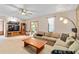 The spacious living room offers neutral carpeting and a ceiling fan at 140 N Star Sw Trl, Atlanta, GA 30331