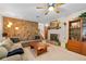 Comfortable living room with a stone fireplace, built-in shelving, and a traditional design at 140 N Star Sw Trl, Atlanta, GA 30331