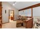 Cozy loft space with a comfortable chair and ottoman, offering a relaxing retreat at 140 N Star Sw Trl, Atlanta, GA 30331