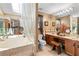 Relaxing main bathroom with a soaking tub, skylight, and double vanity at 140 N Star Sw Trl, Atlanta, GA 30331