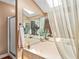 Elegant main bathroom with a large soaking tub, shower, and natural light at 140 N Star Sw Trl, Atlanta, GA 30331