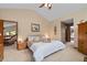 Spacious main bedroom with warm lighting, a sitting area, and ample closet space at 140 N Star Sw Trl, Atlanta, GA 30331