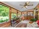 Cozy sunroom with tile floors and views of the green backyard at 140 N Star Sw Trl, Atlanta, GA 30331