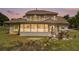 Expansive backyard featuring a screened-in porch and outdoor patio with grilling area at 2425 Wild Oak Ct, Stockbridge, GA 30281