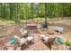 Cozy backyard patio area with comfortable seating and a serene wooded backdrop at 2425 Wild Oak Ct, Stockbridge, GA 30281
