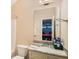Bathroom featuring a marble vanity and a mirrored view into the game room with a pool table at 2425 Wild Oak Ct, Stockbridge, GA 30281