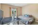 Comfortable bedroom featuring a ping pong table and a balcony with charming French doors at 2425 Wild Oak Ct, Stockbridge, GA 30281