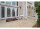 Inviting front entrance with decorative glass doors, seating, and a welcoming doormat at 2425 Wild Oak Ct, Stockbridge, GA 30281