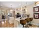 Stylish kitchen showcasing counter seating, pendant lighting, and stainless steel appliances at 2425 Wild Oak Ct, Stockbridge, GA 30281