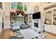 Inviting living room boasting large windows, a fireplace, and custom built-in shelving at 2425 Wild Oak Ct, Stockbridge, GA 30281