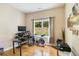 An office with wood floors and backyard views, offers a productive work environment at 2425 Wild Oak Ct, Stockbridge, GA 30281