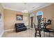 Comfortable office featuring a loveseat, arched windows, and a stylish chandelier at 2425 Wild Oak Ct, Stockbridge, GA 30281
